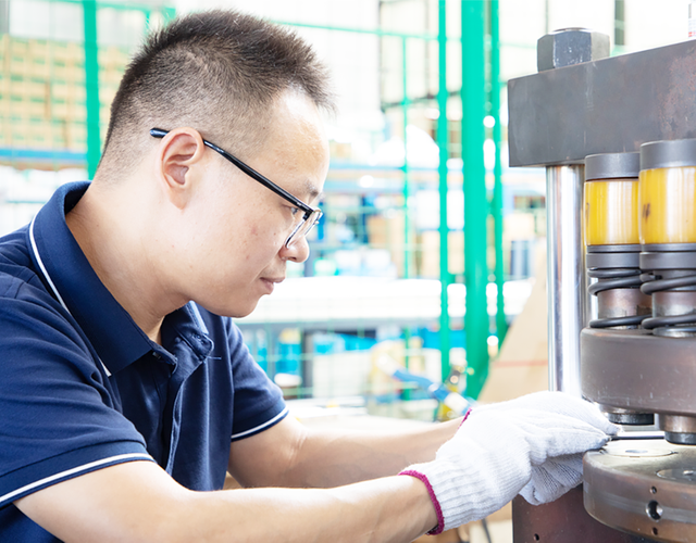 Workers assembling power transformer