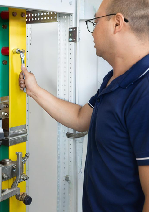 Workers assembling power transformer and switchgear equipment in Shengxian factory