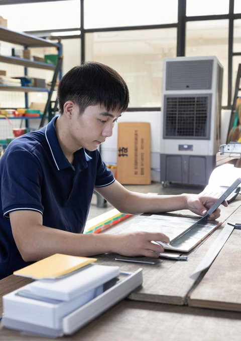 Technicians manufacturing ring main unit and prefabricated substation products